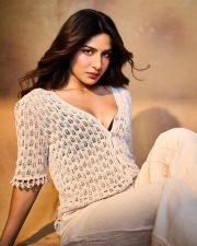 Bai Ga Actress Neha Khan in a Cream Open Knit Cardigan with a Black Polka Dot Bralette and High Waisted Trousers Photos 06