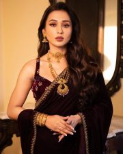 Bhanupriya Bhooter Hotel Actress Mimi Chakraborty in a Deep Wine Colored Velvet Saree with a Sleeveless Velvet Blouse Photos 02