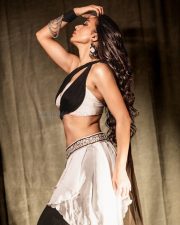Bhanupriya Bhooter Hotel Actress Mimi Chakraborty in a Two Toned Halter Neck Wrap Top and White Asymmetrical Layered Skirt Pictures 06