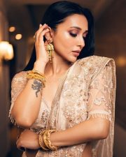 Dazzling Mimi Chakraborty in a Cream Designer Saree Photos 03