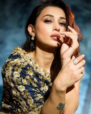 Jaha Bolibo Shotto Bolibo Actress Mimi Chakraborty in a Navy Blue Embroidered One Shoulder Top and a Gold Draped Skirt Photos 01