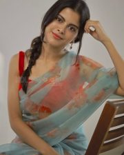 Actress Sanjana Krishnamoorthy in a Floral Saree with a Red Sleeveless Blouse Photos 01
