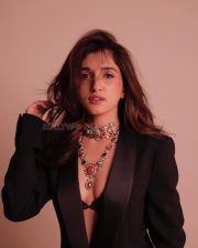 Anupamaa Actress Nidhi Shah in a Black Tuxedo Blazer with a Maroon Bralette and Light Denim Jeans Photos 02