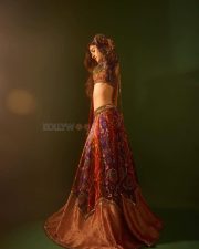 Mesmerizing Actress Nidhi Shah in a Purple Red Embroidered Lehenga Photos 01