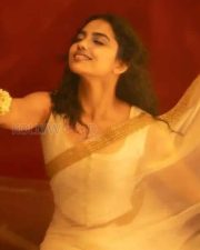 Beautiful Mamitha Baiju in a White Transparent Saree with Gold Border and Sleeveless Blouse Photos 01