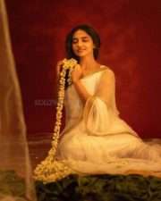 Beautiful Mamitha Baiju in a White Transparent Saree with Gold Border and Sleeveless Blouse Photos 03