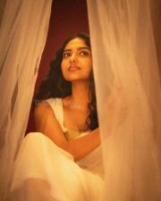 Beautiful Mamitha Baiju in a White Transparent Saree with Gold Border and Sleeveless Blouse Photos 06