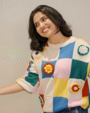 Delightful Actress Mamitha Baiju in a Colorful Crochet Sweater and Blue Jeans Photos 02