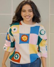 Delightful Actress Mamitha Baiju in a Colorful Crochet Sweater and Blue Jeans Photos 03