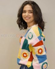 Delightful Actress Mamitha Baiju in a Colorful Crochet Sweater and Blue Jeans Photos 04