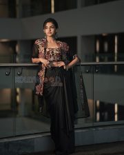 Enigmatic Actress Mamitha Baiju in a Black Embroidered Saree Photos 01