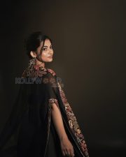 Enigmatic Actress Mamitha Baiju in a Black Embroidered Saree Photos 03