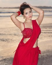 Glamorous Varsha Rekhate in a Red Saree with an Embellished Sleeveless Blouse Photos 05