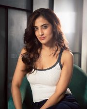 Charming Miloni Johnsa Cleavage in a White Lace Trim Ribbed Cami Top And Blue Jeans Photos 02