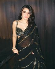 Sexy Nuveksha in a Black Saree with Delicate Golden Sequin Stripes and a Sleeveless Blouse Pictures 02