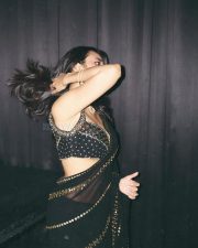 Sexy Nuveksha in a Black Saree with Delicate Golden Sequin Stripes and a Sleeveless Blouse Pictures 04 Sexy Nuveksha in a Black Saree with Delicate Golden Sequin Stripes and a Sleeveless Blouse Pictures 04