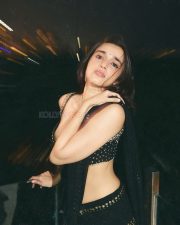 Sexy Nuveksha in a Black Saree with Delicate Golden Sequin Stripes and a Sleeveless Blouse Pictures 05