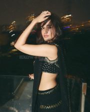 Sexy Nuveksha in a Black Saree with Delicate Golden Sequin Stripes and a Sleeveless Blouse Pictures 06