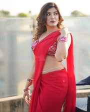 Actress Mrinmai Kolwalkar in a Plain Red Saree with a Sequined Sleeveless Blouse Pictures 05