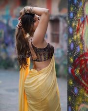 Attractive Mrinmai Kolwalkar in a Yellow Saree with a Sleeveless Blouse Photos 01