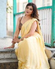 Attractive Mrinmai Kolwalkar in a Yellow Saree with a Sleeveless Blouse Photos 07