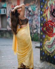 Attractive Mrinmai Kolwalkar in a Yellow Saree with a Sleeveless Blouse Photos 09