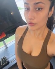 Confident Actress Dhanashree Verma in a Black Sports Bra and Cap Photos 01