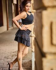 Deceptive Diva Actress Pamela Mondal in a Black Sleeveless Crop Top and a Ruffled Mini Skirt Photos 01