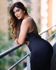 Paap Culture Actress Mrinmai Kolwalkar in a Black Two Piece Spaghetti Strap Crop Top and High Waisted Pants Photos 05