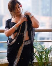 Sophisticated Actress Mrinmai Kolwalkar in a Navy Embroidered Saree Photos 04