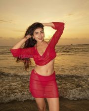 Temptation Island Beauty Ruma Sharma in a Red Sheer Long Sleeved Crop Top and Mini Skirt over a Bikini Photos 03