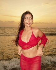 Temptation Island Beauty Ruma Sharma in a Red Sheer Long Sleeved Crop Top and Mini Skirt over a Bikini Photos 04