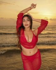 Temptation Island Beauty Ruma Sharma in a Red Sheer Long Sleeved Crop Top and Mini Skirt over a Bikini Photos 05