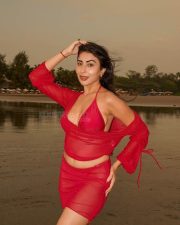 Temptation Island Beauty Ruma Sharma in a Red Sheer Long Sleeved Crop Top and Mini Skirt over a Bikini Photos 09