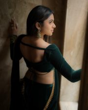 Enchanting Actress Delna Davis in a Dark Green Velvet Saree Photos 03