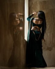 Enchanting Actress Delna Davis in a Dark Green Velvet Saree Photos 05