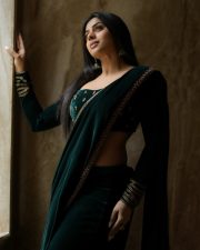 Enchanting Actress Delna Davis in a Dark Green Velvet Saree Photos 06