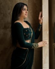 Enchanting Actress Delna Davis in a Dark Green Velvet Saree Photos 08