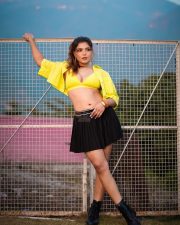 Passionate Actress and Model Tanya Chaudhari in a Yellow Bralette Crop Top and a Black Pleated Mini Skirt Pictures 04