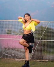 Passionate Actress and Model Tanya Chaudhari in a Yellow Bralette Crop Top and a Black Pleated Mini Skirt Pictures 05