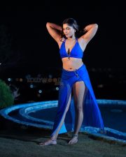 Stunning Tanya Chaudhari in a Two Piece Bright Blue Bikini Halter Neck Top with a Deep Cleavage and High Cut Bikini Bottom and a Sarong Photos 05