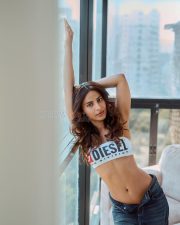 Attractive Ayra Krishna in a White Diesel UFSB Melanie Bandeau Strapless Bra with a Dark Blue Denim Jeans Photos 03