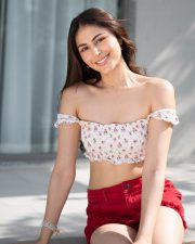 Charming Actress Heer Achhra in a White Floral Crop Top Red Shorts Photos 05