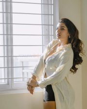 Elegant Actress Vishnu Priya Bhimeneni in a cream linen button up shirt and black bra top photos 08