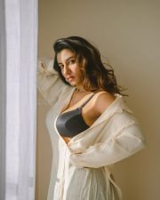 Elegant Actress Vishnu Priya Bhimeneni in a cream linen button up shirt and black bra top photos 09