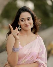 Graceful Actress Kaavya Arivumani in a Pink Shawl Drape Photos 01
