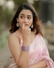Graceful Actress Kaavya Arivumani in a Pink Shawl Drape Photos 02