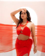 Passionate Actress Vishnu Priya Bhimeneni in a Red Halter Crop Top and Slit Skirt Photos 01