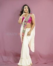Resplendent Vishnu Priya Bhimeneni Cleavage in a White Embroidered Saree and Hot Pink Deep V Neck Blouse Photos 03