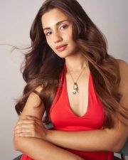 Akshardham Operation Vajra Shakti Actress Anushkaa Luhar in a Red Halter Neck Dress with Deep Cleavage Neckline Photos 01